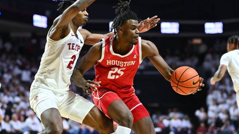 Feb 5, 2023; Philadelphia, Pennsylvania, USA; Houston Cougars forward Jarace Walker (25) controls the ball against Temple Owls guard Jahlil White (2) in the first half at The Liacouras Center. Mandatory Credit: Kyle Ross-USA TODAY Sports