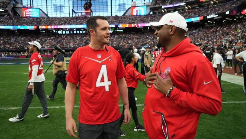 Feb 5, 2023; Paradise, Nevada, USA; AFC quarterback Derek Carr of the Las Vegas Raiders (4) talks with defensive coordinator Ray Lewis against the NFC during the Pro Bowl Games at Allegiant Stadium. Mandatory Credit: Kirby Lee-USA TODAY Sports