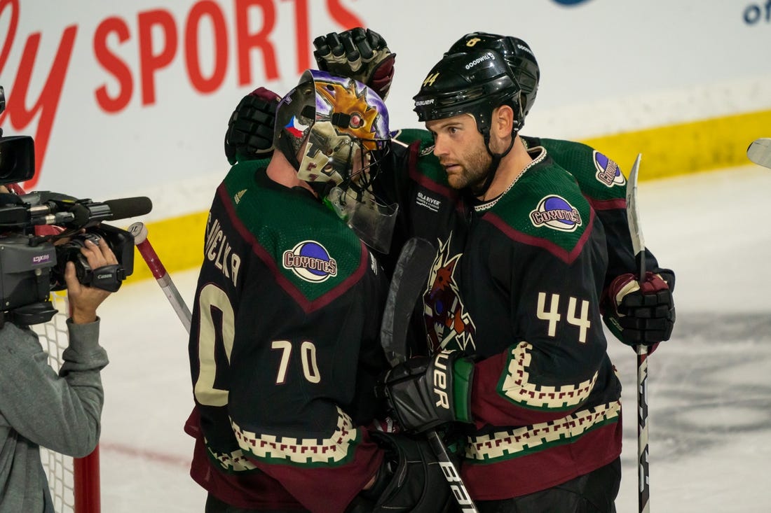 Feb 6, 2023; Tempe, Arizona, USA;  Arizona Coyotes goalie Karel Vejmelka (70) celebrates with right wing Zack Kassian (44) after beating the Minnesota Wild 3-2 at Mullett Arena. Mandatory Credit: Allan Henry-USA TODAY Sports