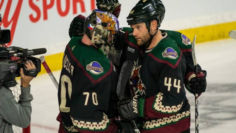 Feb 6, 2023; Tempe, Arizona, USA;  Arizona Coyotes goalie Karel Vejmelka (70) celebrates with right wing Zack Kassian (44) after beating the Minnesota Wild 3-2 at Mullett Arena. Mandatory Credit: Allan Henry-USA TODAY Sports