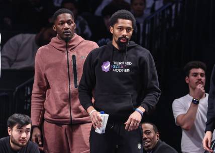 Feb 7, 2023; Brooklyn, New York, USA; Brooklyn Nets guard Spencer Dinwiddie (right) and forward Dorian Finney-Smith (left) looks on during the first half against the Phoenix Suns at Barclays Center. Mandatory Credit: Vincent Carchietta-USA TODAY Sports