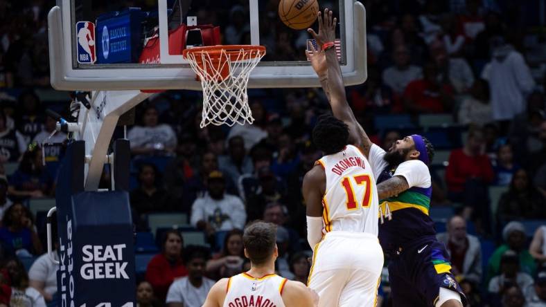 Feb 7, 2023; New Orleans, Louisiana, USA;  New Orleans Pelicans forward Brandon Ingram (14) drives to the basket against Atlanta Hawks forward Onyeka Okongwu (17) during the first half at Smoothie King Center. Mandatory Credit: Stephen Lew-USA TODAY Sports