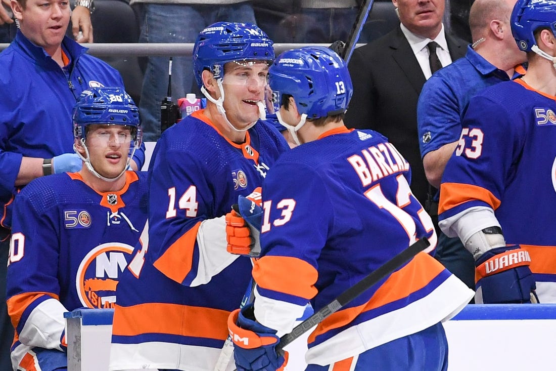 Feb 7, 2023; Elmont, New York, USA;  New York Islanders center Mathew Barzal (13) congratulates New York Islanders center Bo Horvat (14) on his first goal as a New York Islander against the Seattle Kraken during the second period at UBS Arena. Mandatory Credit: Dennis Schneidler-USA TODAY Sports