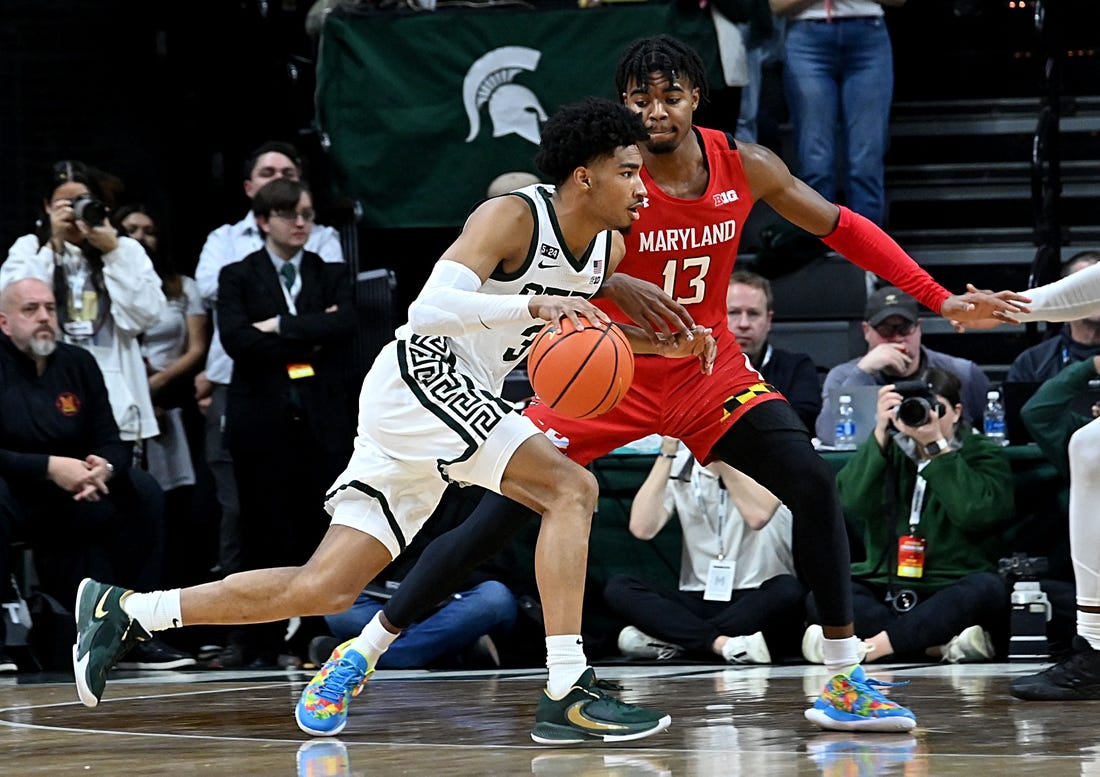 Feb 7, 2023; East Lansing, Michigan, USA;  Michigan State Spartans guard Jaden Akins (3) drives past Maryland Terrapins guard Hakim Hart (13) in the first half at Jack Breslin Student Events Center. Mandatory Credit: Dale Young-USA TODAY Sports