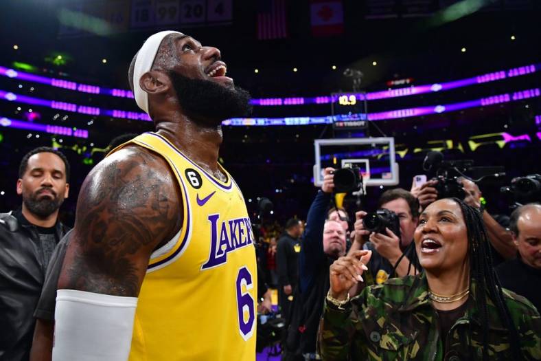 Los Angeles Lakers forward LeBron James (6) celebrates with his mother Gloria James after breaking the all-time scoring record in the third quarter against the Oklahoma City Thunder at Crypto.com Arena. Mandatory Credit: Gary A. Vasquez-USA TODAY Sports