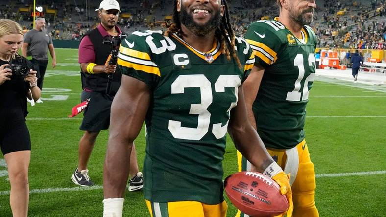 Green Bay Packers running back Aaron Jones (33) and Green Bay Packers quarterback Aaron Rodgers (12) walk of the after their game against the Green Bay Packers on Sunday, Sept. 18, 2022 at Lambeau Field in Green Bay.

Best 2022 26