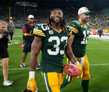 Green Bay Packers running back Aaron Jones (33) and Green Bay Packers quarterback Aaron Rodgers (12) walk of the after their game against the Green Bay Packers on Sunday, Sept. 18, 2022 at Lambeau Field in Green Bay.

Best 2022 26