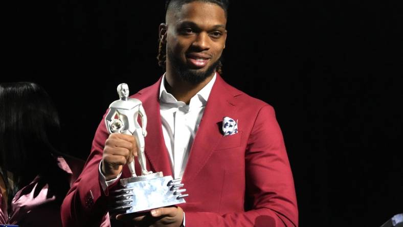 Feb 8, 2023; Phoenix, AZ, USA; Buffalo Bills safety Damar Hamlin accepts the Alan Page Community Award during the NFLPA press conference at the Phoenix Convention Center. Mandatory Credit: Kirby Lee-USA TODAY Sports