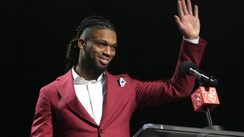 Feb 8, 2023; Phoenix, AZ, USA; Buffalo Bills safety Damar Hamlin accepts the Alan Page Community Award during the NFLPA press conference at the Phoenix Convention Center. Mandatory Credit: Kirby Lee-USA TODAY Sports