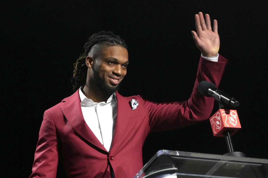 Feb 8, 2023; Phoenix, AZ, USA; Buffalo Bills safety Damar Hamlin accepts the Alan Page Community Award during the NFLPA press conference at the Phoenix Convention Center. Mandatory Credit: Kirby Lee-USA TODAY Sports