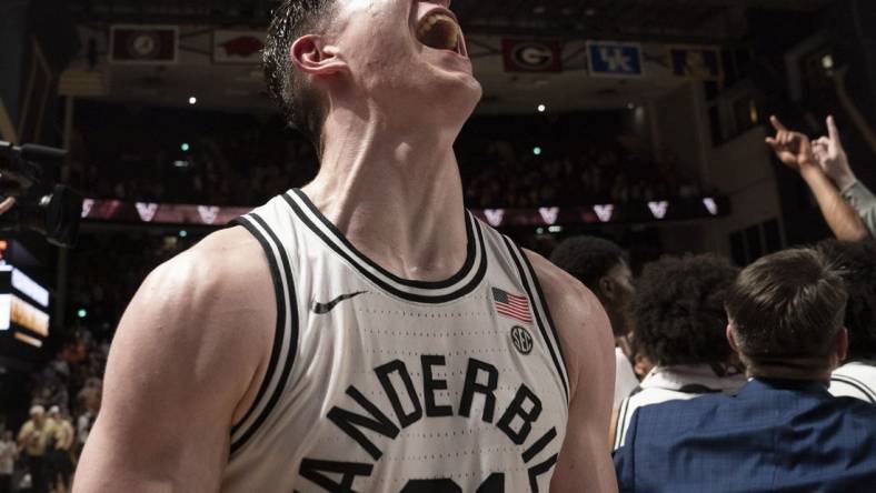 Feb 8, 2023; Nashville, Tennessee, USA;   Vanderbilt Commodores forward Liam Robbins (21) celebrates after defeating the Tennessee Volunteers 66 to 65 at Memorial Gymnasium.  Mandatory Credit: George Walker IV - USA TODAY Sports