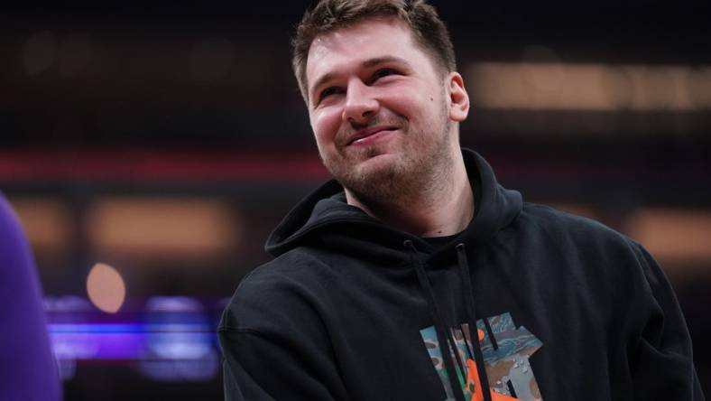 Feb 10, 2023; Sacramento, California, USA; Dallas Mavericks guard Luka Doncic (77) stands on the court during a timeout against the Sacramento Kings in the first quarter at the Golden 1 Center. Mandatory Credit: Cary Edmondson-USA TODAY Sports