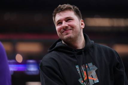 Feb 10, 2023; Sacramento, California, USA; Dallas Mavericks guard Luka Doncic (77) stands on the court during a timeout against the Sacramento Kings in the first quarter at the Golden 1 Center. Mandatory Credit: Cary Edmondson-USA TODAY Sports