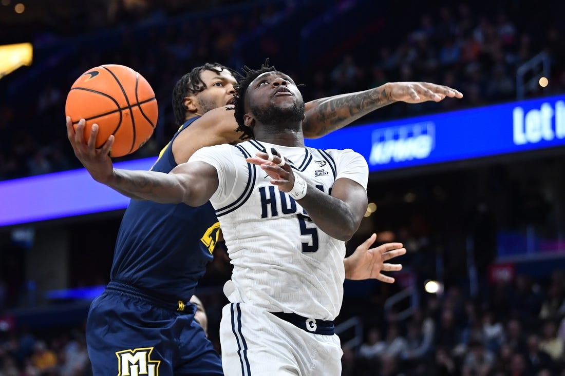 Feb 11, 2023; Washington, District of Columbia, USA; Georgetown Hoyas guard Jay Heath (5) shoots against the Marquette Golden Eagles during the first half at Capital One Arena. Mandatory Credit: Brad Mills-USA TODAY Sports