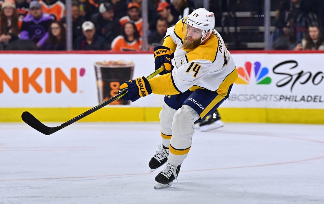 Feb 11, 2023; Philadelphia, Pennsylvania, USA; Nashville Predators defenseman Mattias Ekholm (14) clears the puck against the Philadelphia Flyers in the first period at Wells Fargo Center. Mandatory Credit: Kyle Ross-USA TODAY Sports