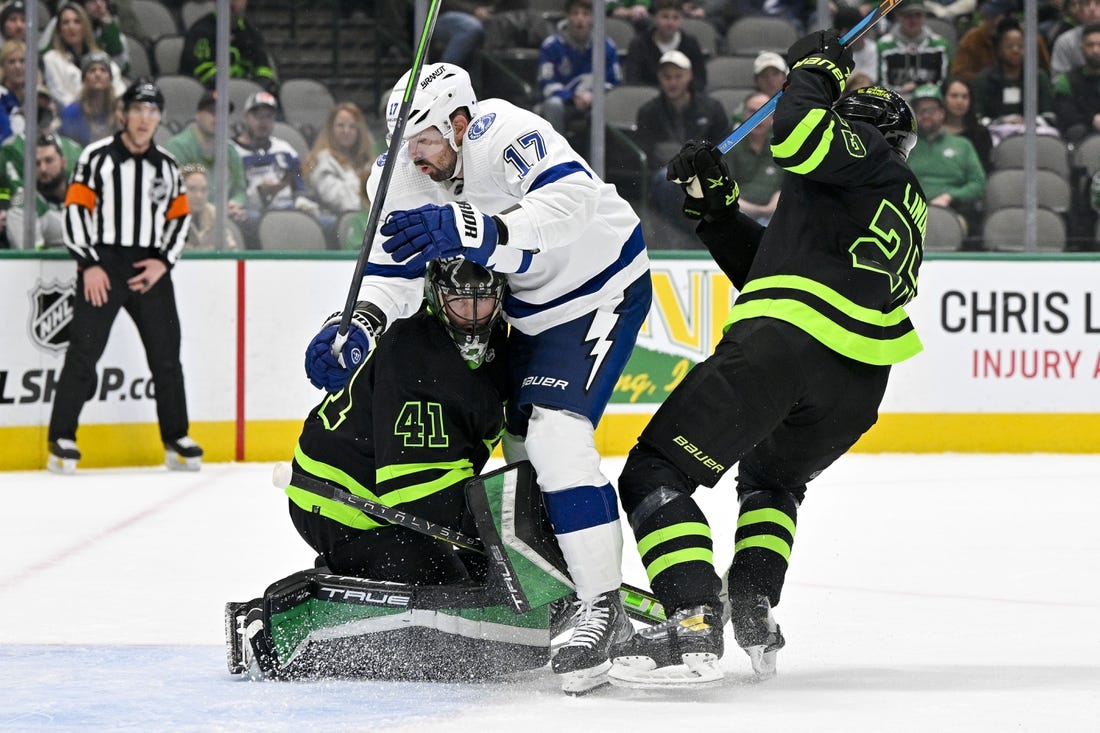 Feb 11, 2023; Dallas, Texas, USA; Tampa Bay Lightning left wing Alex Killorn (17) crashes into Dallas Stars goaltender Scott Wedgewood (41) in the Stars zone during the first period at the American Airlines Center. Mandatory Credit: Jerome Miron-USA TODAY Sports