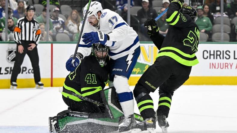 Feb 11, 2023; Dallas, Texas, USA; Tampa Bay Lightning left wing Alex Killorn (17) crashes into Dallas Stars goaltender Scott Wedgewood (41) in the Stars zone during the first period at the American Airlines Center. Mandatory Credit: Jerome Miron-USA TODAY Sports