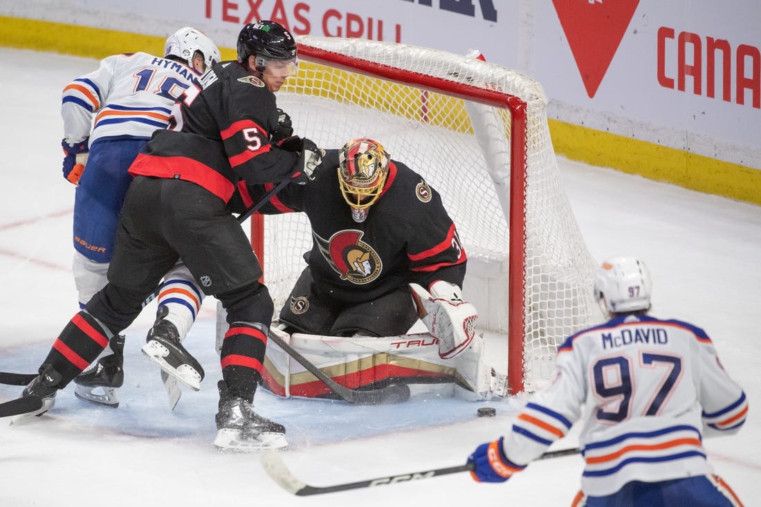 Feb 11, 2023; Ottawa, Ontario, CAN; Ottawa Senators goalie Anton Forsberg (31) makes a save in the third period against the Edmonton Oilers at the Canadian Tire Centre. Mandatory Credit: Marc DesRosiers-USA TODAY Sports