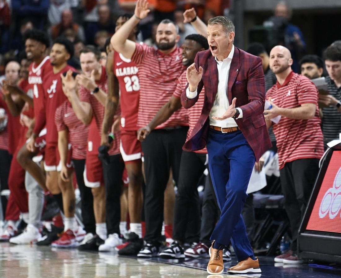 Feb 11, 2023; Auburn, Alabama, USA;  Alabama Crimson Tide head coach Nate Oats cheers on the team against the Auburn Tigers at Neville Arena. Mandatory Credit: Julie Bennett-USA TODAY Sports