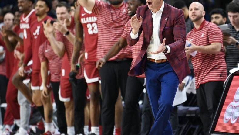 Feb 11, 2023; Auburn, Alabama, USA;  Alabama Crimson Tide head coach Nate Oats cheers on the team against the Auburn Tigers at Neville Arena. Mandatory Credit: Julie Bennett-USA TODAY Sports