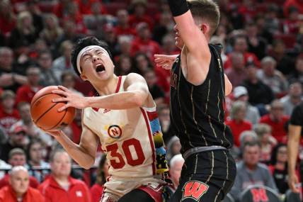 Feb 11, 2023; Lincoln, Nebraska, USA;  Nebraska Cornhuskers guard Keisei Tominaga (30) reacts after being fouled by Wisconsin Badgers guard Connor Essegian (3) in the first half at Pinnacle Bank Arena. Mandatory Credit: Steven Branscombe-USA TODAY Sports