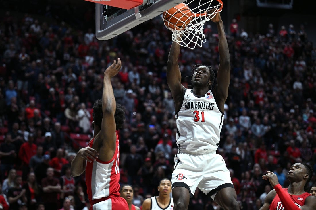 Feb 11, 2023; San Diego, California, USA; San Diego State Aztecs forward Nathan Mensah (31) dunks the ball during the first half against the UNLV Rebels at Viejas Arena. Mandatory Credit: Orlando Ramirez-USA TODAY Sports