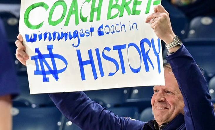 Feb 11, 2023; South Bend, Indiana, USA; A fan holds a sign thanking Notre Dame Fighting Irish head coach Mike Brey during the game against the Virginia Tech Hokies at the Purcell Pavilion. Brey announced he is stepping down from coaching at Notre Dame at the end of the season. Mandatory Credit: Matt Cashore-USA TODAY Sports