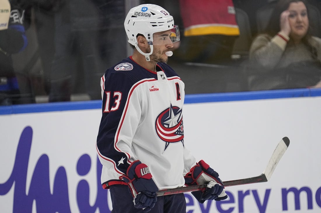 Feb 11, 2023; Toronto, Ontario, CAN;  Columbus Blue Jackets forward Johnny Gaudreau (13) blows a bubble during the warm-up before a game against the Toronto Maple Leafs at Scotiabank Arena. Mandatory Credit: John E. Sokolowski-USA TODAY Sports