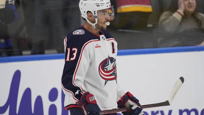 Feb 11, 2023; Toronto, Ontario, CAN;  Columbus Blue Jackets forward Johnny Gaudreau (13) blows a bubble during the warm-up before a game against the Toronto Maple Leafs at Scotiabank Arena. Mandatory Credit: John E. Sokolowski-USA TODAY Sports