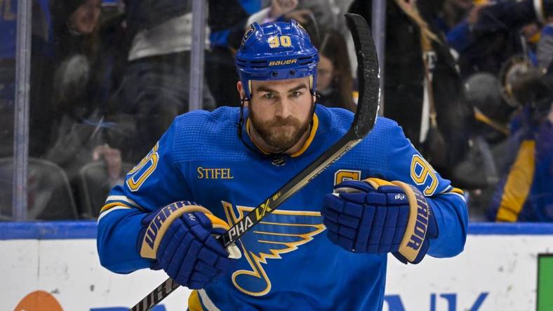 Feb 11, 2023; St. Louis, Missouri, USA;  St. Louis Blues center Ryan O'Reilly (90) reacts after scoring the game winning goal against the Arizona Coyotes during overtime at Enterprise Center. Mandatory Credit: Jeff Curry-USA TODAY Sports