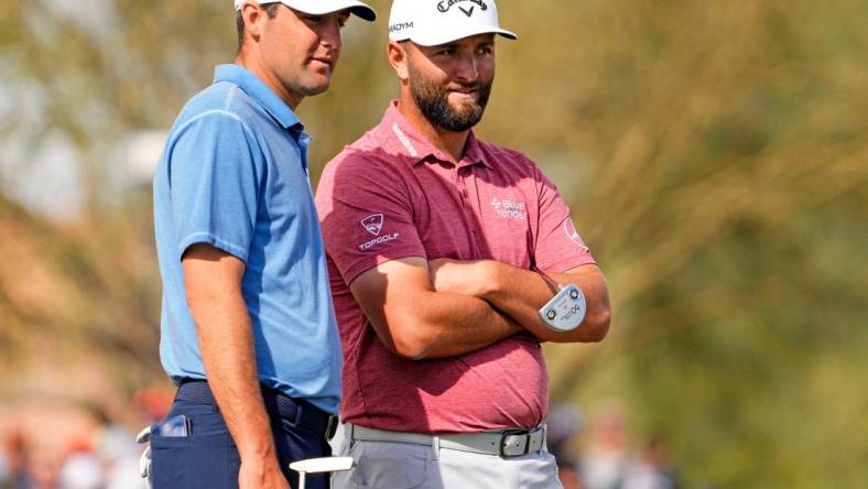 Scottie Scheffler and Jon Rahm talk on the green at the second hole during the final round of the WM Phoenix Open at TPC Scottsdale on Feb. 12, 2023.

Pga Wm Phoenix Open Final Round