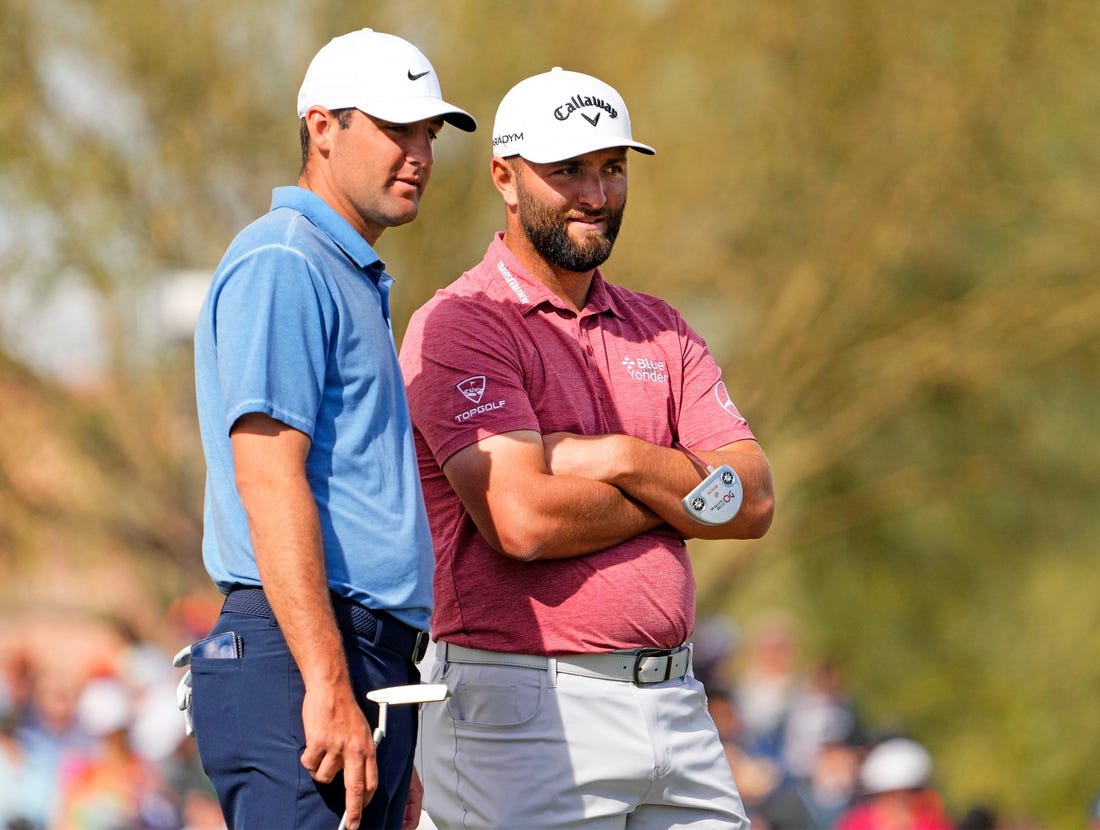 Scottie Scheffler and Jon Rahm talk on the green at the second hole during the final round of the WM Phoenix Open at TPC Scottsdale on Feb. 12, 2023.

Pga Wm Phoenix Open Final Round