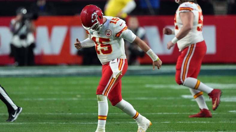 Feb 12, 2023; Glendale, Arizona, US; Kansas City Chiefs quarterback Patrick Mahomes (15) reacts an apparent injury after a play in the second quarter of Super Bowl LVII at State Farm Stadium. Mandatory Credit: Joe Camporeale-USA TODAY Sports