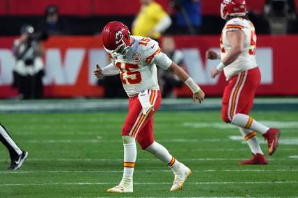Feb 12, 2023; Glendale, Arizona, US; Kansas City Chiefs quarterback Patrick Mahomes (15) reacts an apparent injury after a play in the second quarter of Super Bowl LVII at State Farm Stadium. Mandatory Credit: Joe Camporeale-USA TODAY Sports