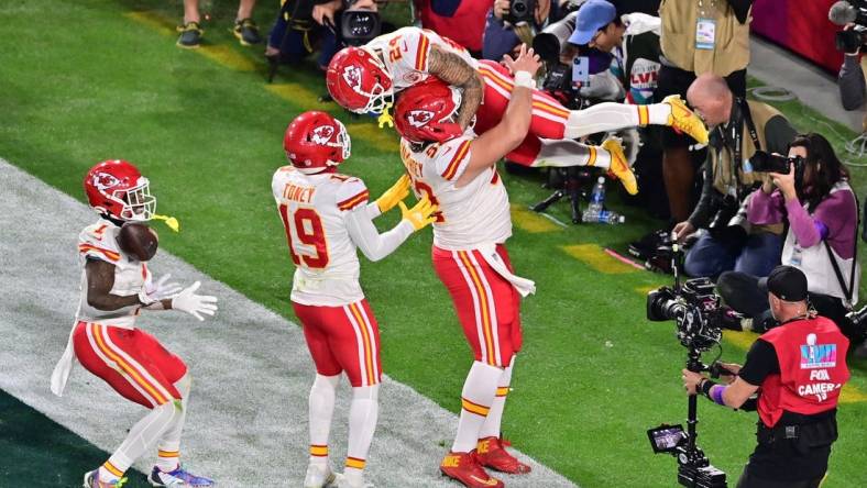 Feb 12, 2023; Glendale, Arizona, US; Kansas City Chiefs wide receiver Skyy Moore (24) celebrates with center Creed Humphrey (52) and wide receiver Kadarius Toney (19) and running back Jerick McKinnon (1) after scoring a touchdown against the Philadelphia Eagles during the fourth quarter of Super Bowl LVII at State Farm Stadium. Mandatory Credit: Matt Kartozian-USA TODAY Sports