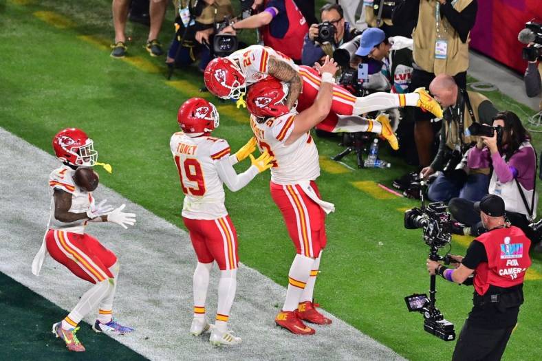 Feb 12, 2023; Glendale, Arizona, US; Kansas City Chiefs wide receiver Skyy Moore (24) celebrates with center Creed Humphrey (52) and wide receiver Kadarius Toney (19) and running back Jerick McKinnon (1) after scoring a touchdown against the Philadelphia Eagles during the fourth quarter of Super Bowl LVII at State Farm Stadium. Mandatory Credit: Matt Kartozian-USA TODAY Sports