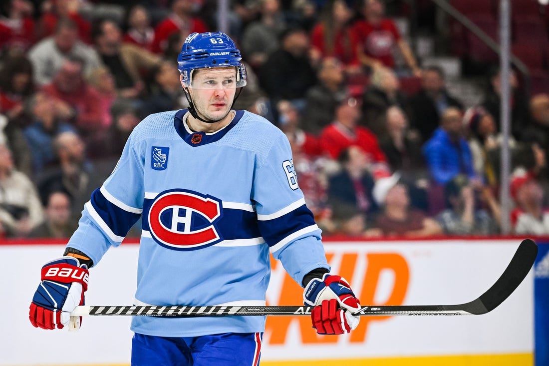 Feb 11, 2023; Montreal, Quebec, CAN; Montreal Canadiens right wing Evgenii Dadonov (63) against the New York Islanders during the third period at Bell Centre. Mandatory Credit: David Kirouac-USA TODAY Sports