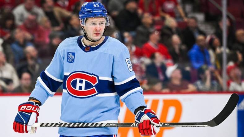 Feb 11, 2023; Montreal, Quebec, CAN; Montreal Canadiens right wing Evgenii Dadonov (63) against the New York Islanders during the third period at Bell Centre. Mandatory Credit: David Kirouac-USA TODAY Sports