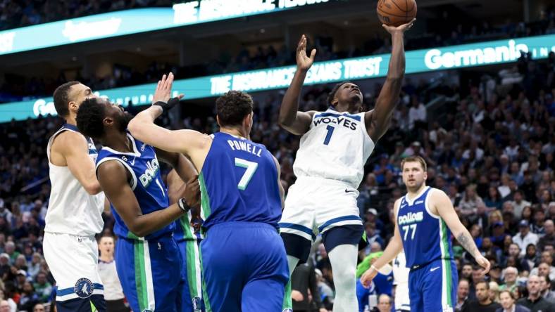 Feb 13, 2023; Dallas, Texas, USA;  Minnesota Timberwolves guard Anthony Edwards (1) shoots during the second quarter against the Dallas Mavericks at American Airlines Center. Mandatory Credit: Kevin Jairaj-USA TODAY Sports