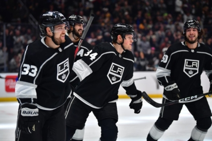 Feb 13, 2023; Los Angeles, California, USA; Los Angeles Kings right wing Arthur Kaliyev (34) celebrates his power play goal scored against the Buffalo Sabres with right wing Viktor Arvidsson (33) and defenseman Sean Durzi (50) during the second period at Crypto.com Arena. Mandatory Credit: Gary A. Vasquez-USA TODAY Sports