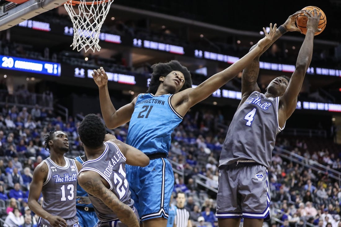 Feb 14, 2023; Newark, New Jersey, USA;  Georgetown Hoyas center Ryan Mutombo (21) and Seton Hall Pirates forward Tyrese Samuel (4) fight for a rebound in the first half at Prudential Center. Mandatory Credit: Wendell Cruz-USA TODAY Sports