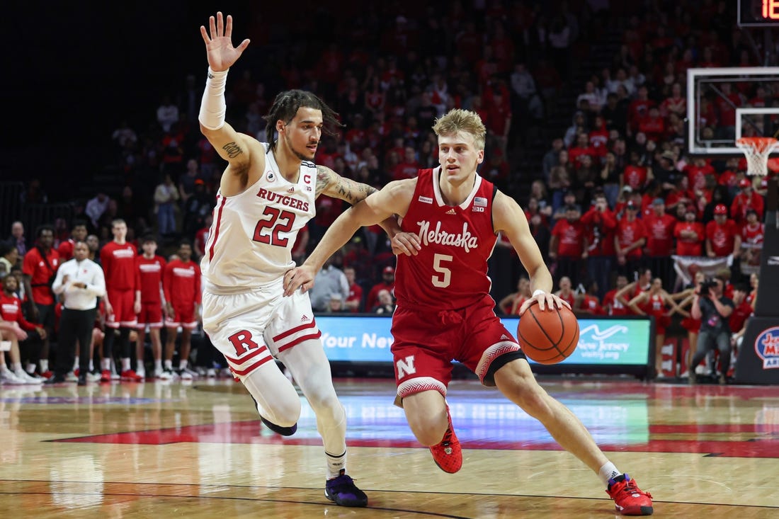 Feb 14, 2023; Piscataway, New Jersey, USA; Nebraska Cornhuskers guard Sam Griesel (5) dribbles against Rutgers Scarlet Knights guard Caleb McConnell (22) during the first half at Jersey Mike's Arena. Mandatory Credit: Vincent Carchietta-USA TODAY Sports