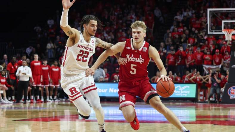 Feb 14, 2023; Piscataway, New Jersey, USA; Nebraska Cornhuskers guard Sam Griesel (5) dribbles against Rutgers Scarlet Knights guard Caleb McConnell (22) during the first half at Jersey Mike's Arena. Mandatory Credit: Vincent Carchietta-USA TODAY Sports