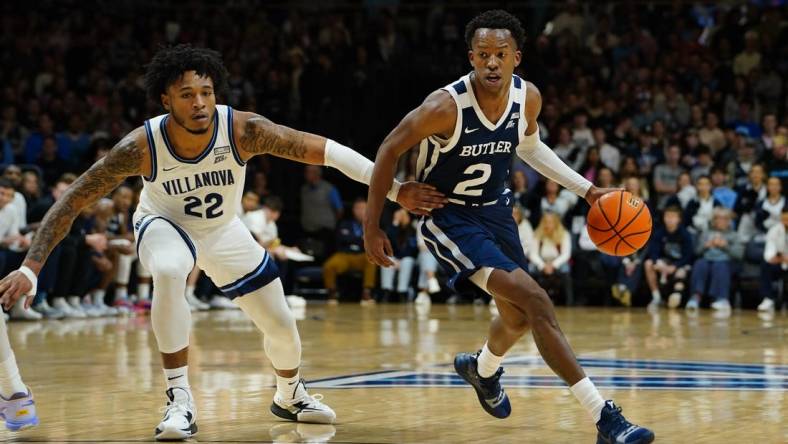 Feb 14, 2023; Villanova, Pennsylvania, USA; Butler Bulldogs guard Eric Hunter Jr. (2) dribbles the ball against Villanova Wildcats forward Cam Whitmore (22) during the first half  at William B. Finneran Pavilion. Mandatory Credit: Gregory Fisher-USA TODAY Sports