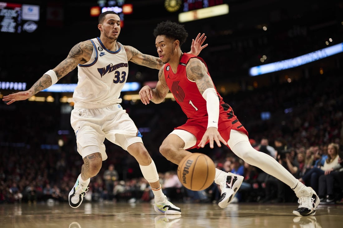 Feb 14, 2023; Portland, Oregon, USA; Portland Trail Blazers guard Anfernee Simons (1) drives to the basket during the second half against Washington Wizards forward Kyle Kuzma (33) at Moda Center. Mandatory Credit: Troy Wayrynen-USA TODAY Sports