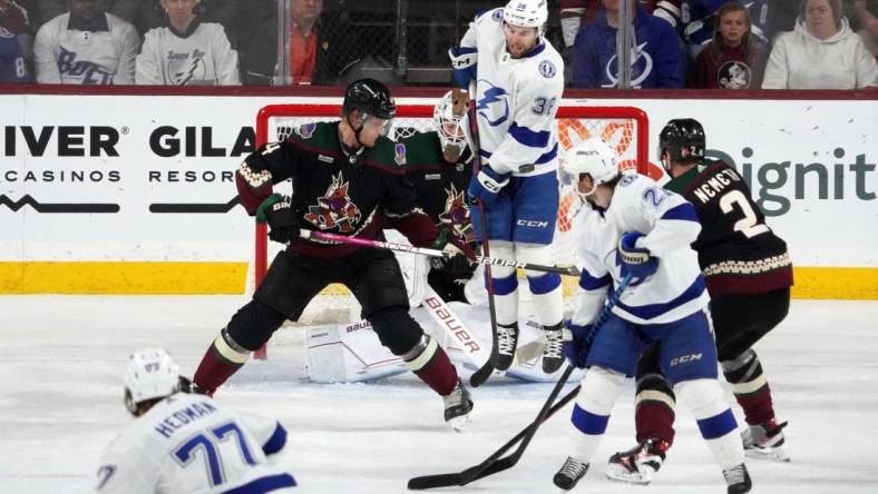 Feb 15, 2023; Tempe, Arizona, USA; Tampa Bay Lightning left wing Brandon Hagel (38) attempts to deflect a shot by Tampa Bay Lightning defenseman Victor Hedman (77) against the Arizona Coyotes during the first period at Mullett Arena. Mandatory Credit: Joe Camporeale-USA TODAY Sports