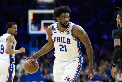 Feb 15, 2023; Philadelphia, Pennsylvania, USA; Philadelphia 76ers center Joel Embiid (21) dribbles the ball against the Cleveland Cavaliers during the third quarter at Wells Fargo Center. Mandatory Credit: Bill Streicher-USA TODAY Sports