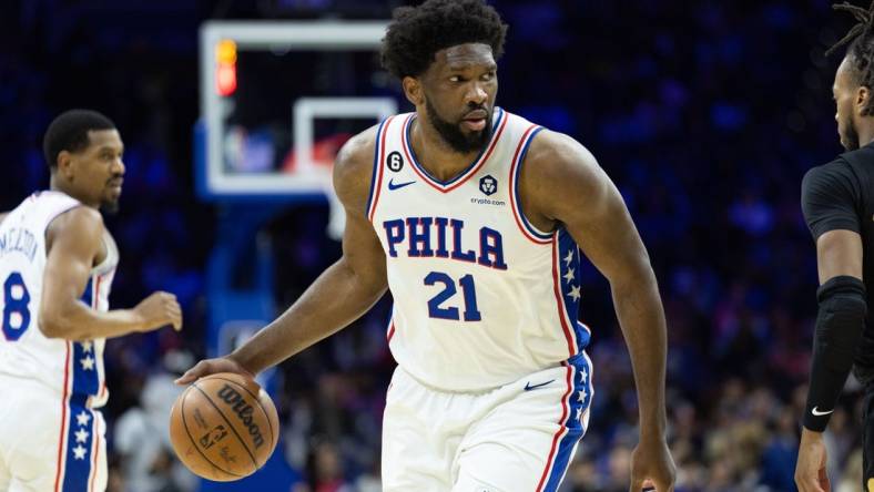 Feb 15, 2023; Philadelphia, Pennsylvania, USA; Philadelphia 76ers center Joel Embiid (21) dribbles the ball against the Cleveland Cavaliers during the third quarter at Wells Fargo Center. Mandatory Credit: Bill Streicher-USA TODAY Sports