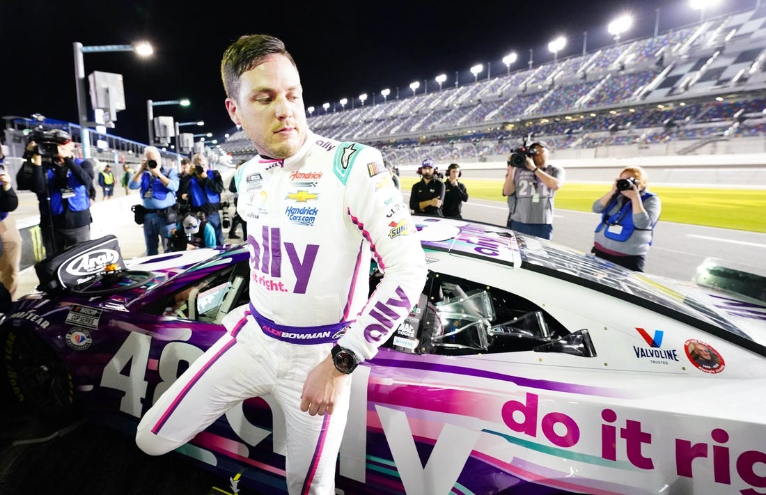 Feb 15, 2023; Daytona Beach, Florida, USA; NASCAR Cup Series driver Alex Bowman (48) exits his car as he celebrates winning the pole during qualifying at Daytona International Speedway. Mandatory Credit: John David Mercer-USA TODAY Sports