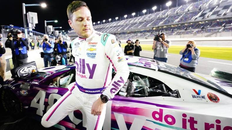 Feb 15, 2023; Daytona Beach, Florida, USA; NASCAR Cup Series driver Alex Bowman (48) exits his car as he celebrates winning the pole during qualifying at Daytona International Speedway. Mandatory Credit: John David Mercer-USA TODAY Sports